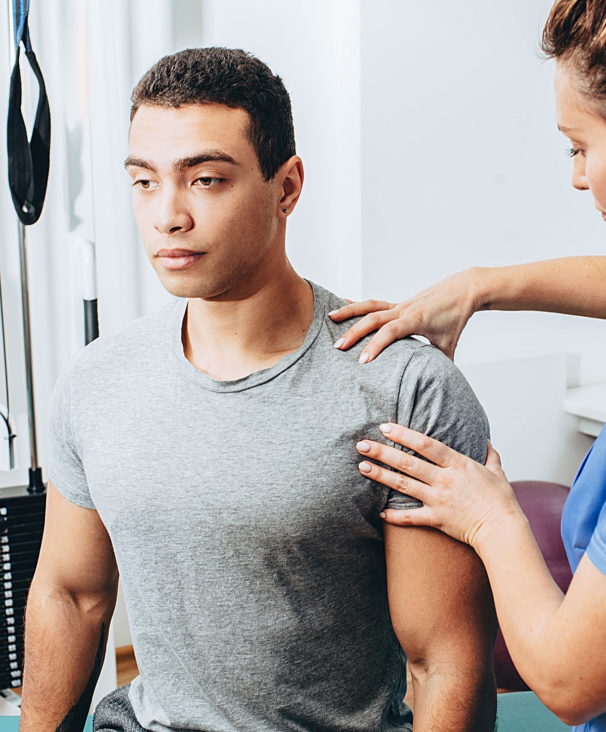 Physical therapy session focusing on shoulder assessment.